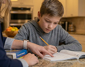 Child solving on paper