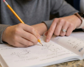 Child solving on paper