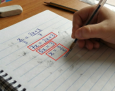 Child solving on paper